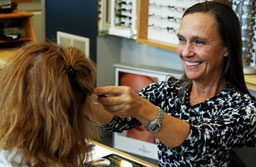 woman trying on glasses